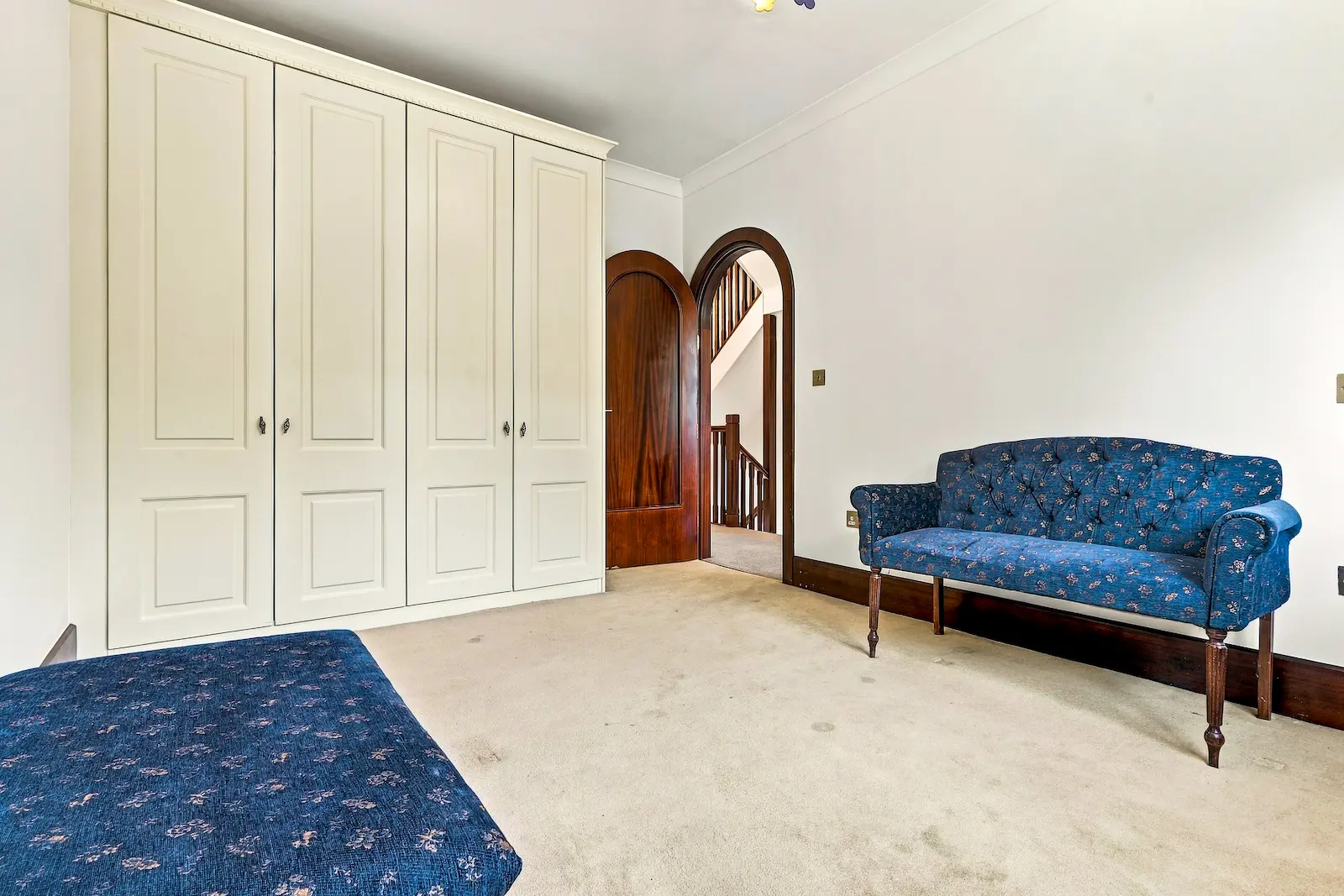 Bedroom with dated furniture